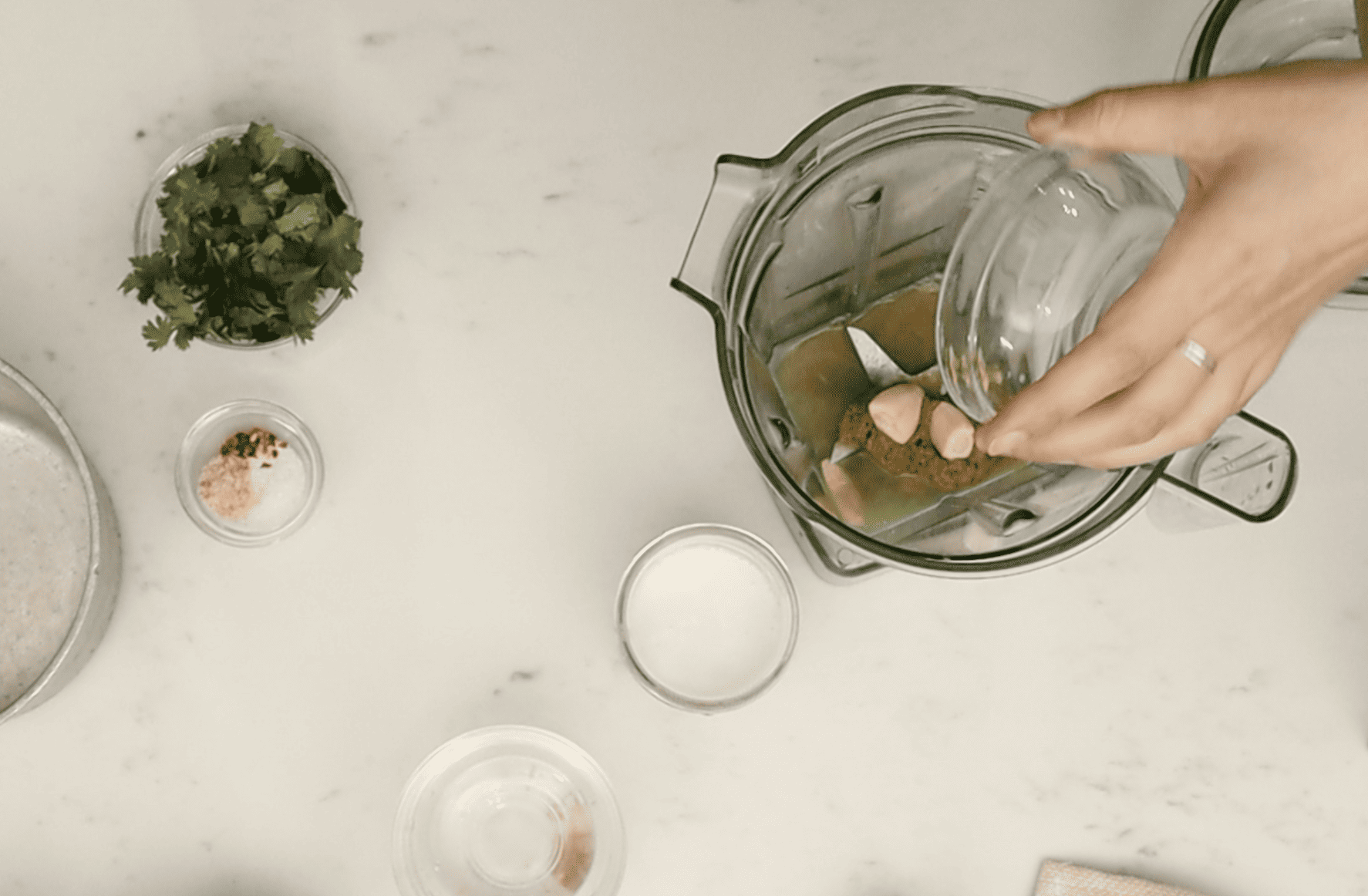 ingredients being added to blender for sauce