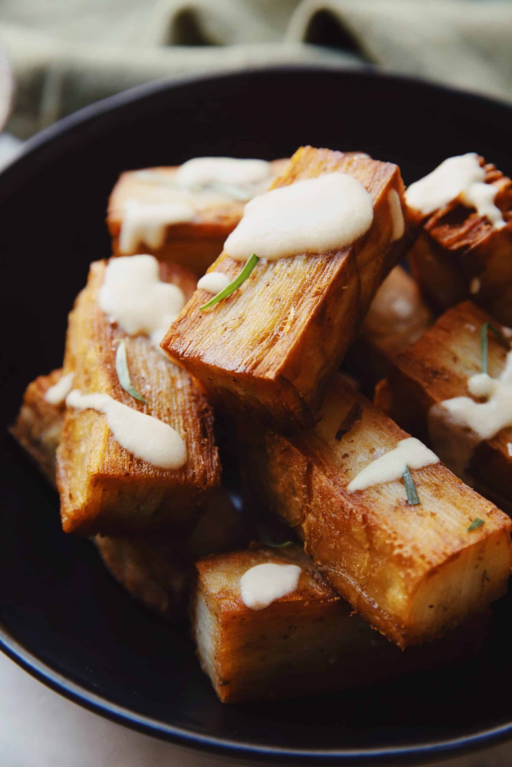 potato pave with bernaise sauce in a bowl