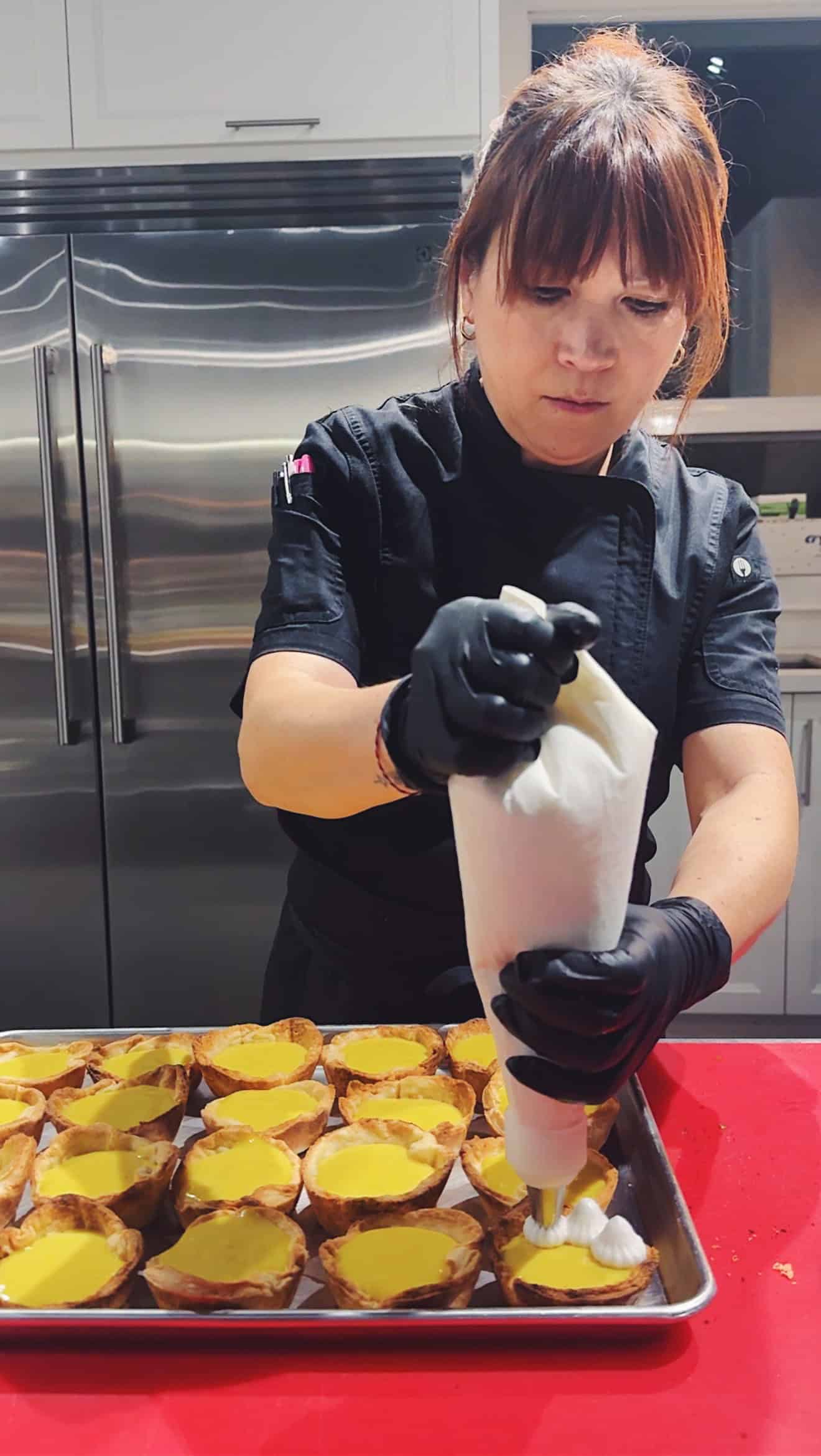 chef Lauren Toyota piping meringue